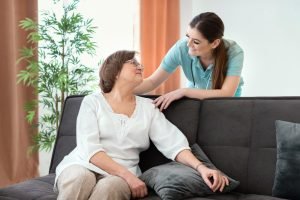 overnight home caregiver talking to her patient